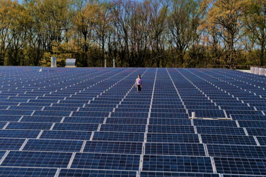2012: Emily, a McGrory grandchild, stands in the midst of the newly installed solar panel roof.